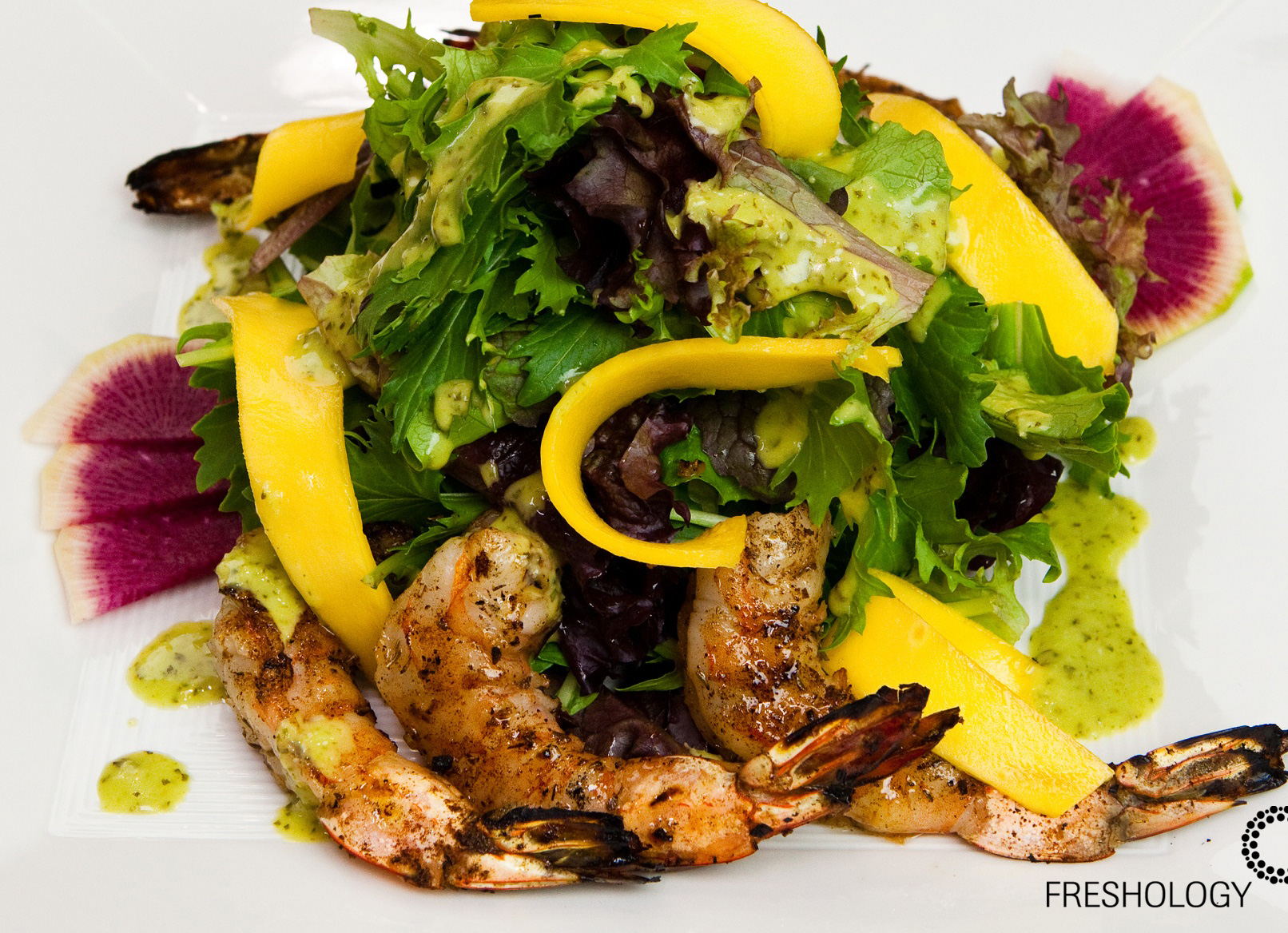 Grilled shrimp mango mixed green salad